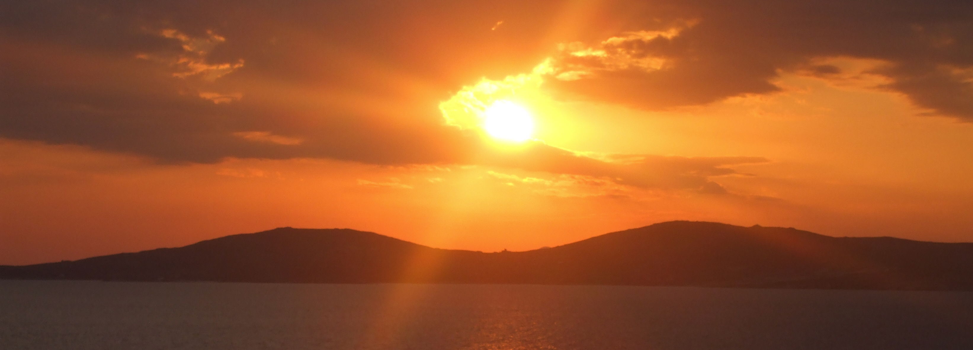 Sunset view from Mykonos Grand Hotel looking towards Delos, birthplace of Artemis and Apollo 