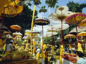 francis-robert-parasols-in-taman-pile-hindu-temple-on-koningan-day-bali-indonesia