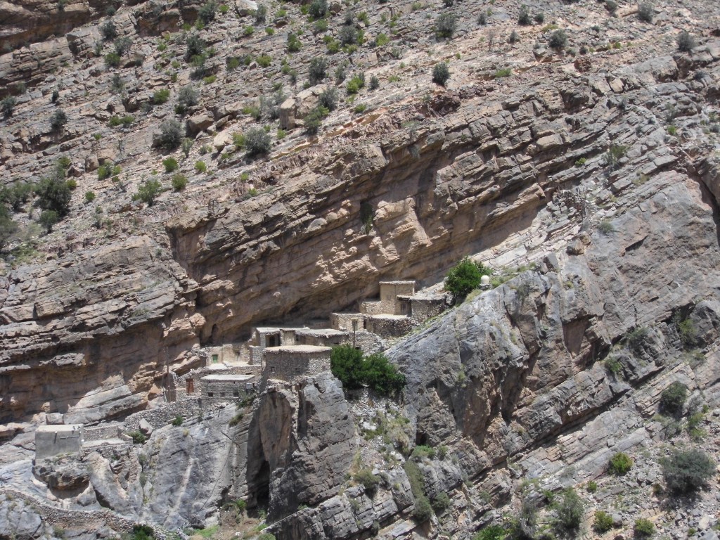 Abandoned village plugged into a sheer cliff face